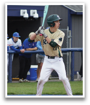A baseball player in a green shirt and white pants is throwing a ball. Description generated by AI