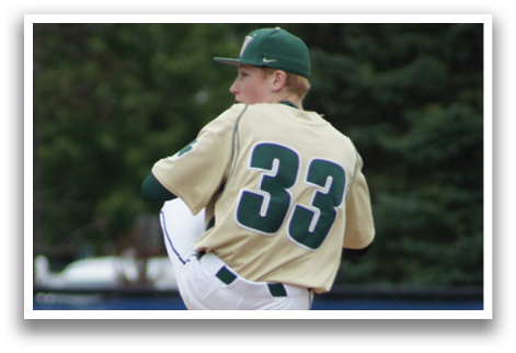 A baseball player is standing at home plate, holding a bat. Description generated by AI