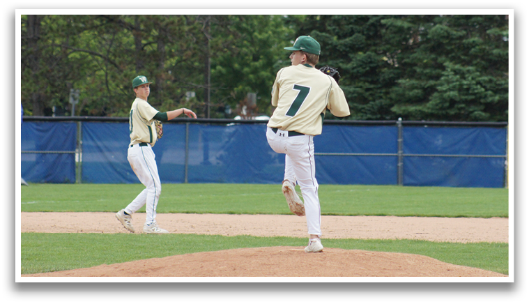 A group of baseball players wearing green and white uniforms. Description generated by AI