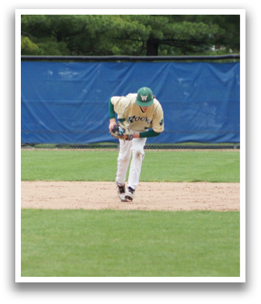 A baseball player in a green and white uniform is pitching a ball. Description generated by AI