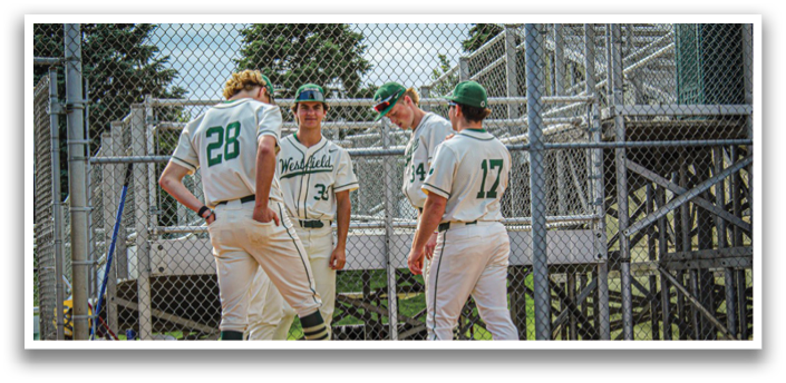 Baseball players wearing white uniforms. Description generated by AI