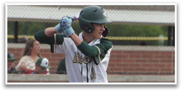 A baseball player is holding a bat and getting ready to swing. Description generated by AI