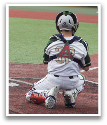 A baseball player is sitting on the ground with his helmet on. Description generated by AI