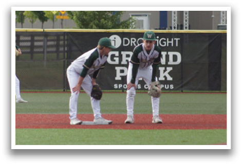 A baseball game is taking place on a field. Description generated by AI