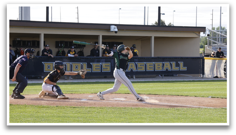 A baseball player is swinging a bat at a ball. Description generated by AI