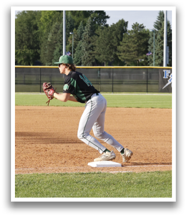 A baseball player in a green and white uniform is throwing a ball. Description generated by AI