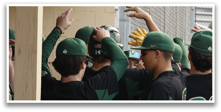 A group of baseball players wearing green hats and black shirts. Description generated by AI