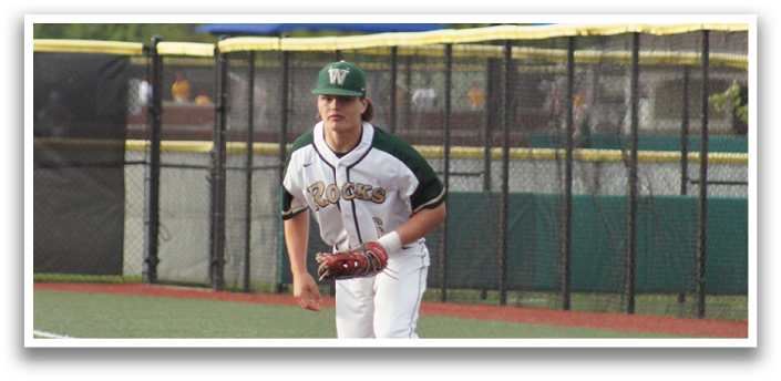 A baseball player in a white uniform is throwing a ball. Description generated by AI