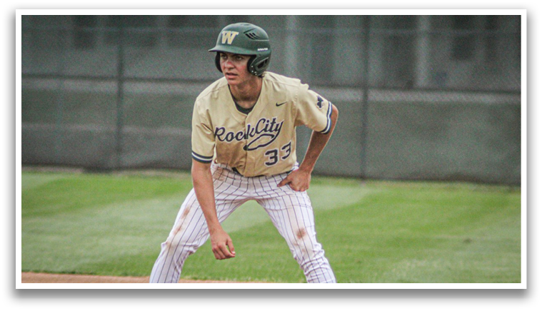 A baseball player wearing a green helmet and a gold jersey. Description generated by AI