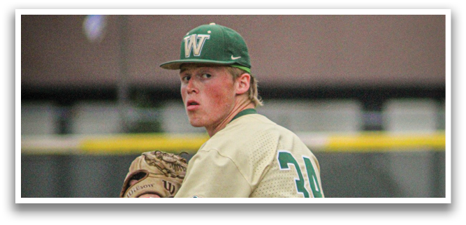 A baseball player wearing a yellow and green uniform. Description generated by AI