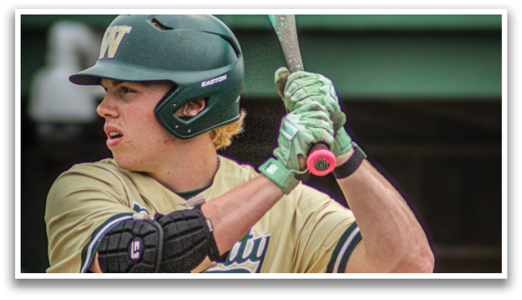 A baseball player wearing a green helmet and a gold jersey. Description generated by AI