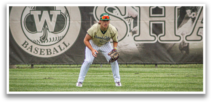 A baseball player wearing a green helmet and white pants. Description generated by AI