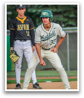 A baseball player wearing a green helmet and white uniform. Description generated by AI