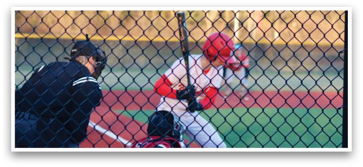 A baseball player is swinging a bat at a ball. Description generated by AI