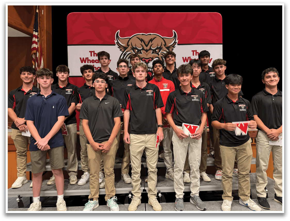 A group of young men wearing black shirts and khaki pants. Description generated by AI