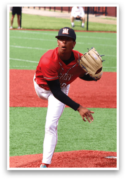 A baseball player in a red shirt and white pants is pitching a ball. Description generated by AI
