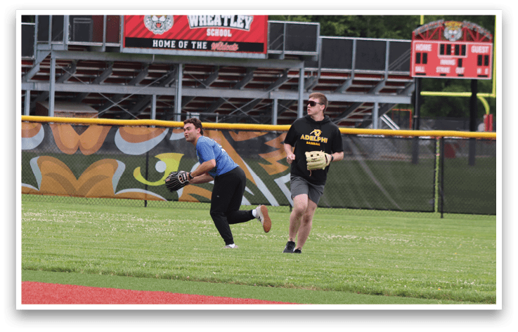 A man running on a field with a tiger logo. Description generated by AI