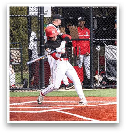 A baseball player in a red and white uniform is swinging a bat. Description generated by AI