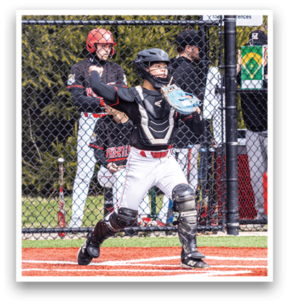 A baseball player in a black helmet and white uniform is holding a baseball bat. Description generated by AI