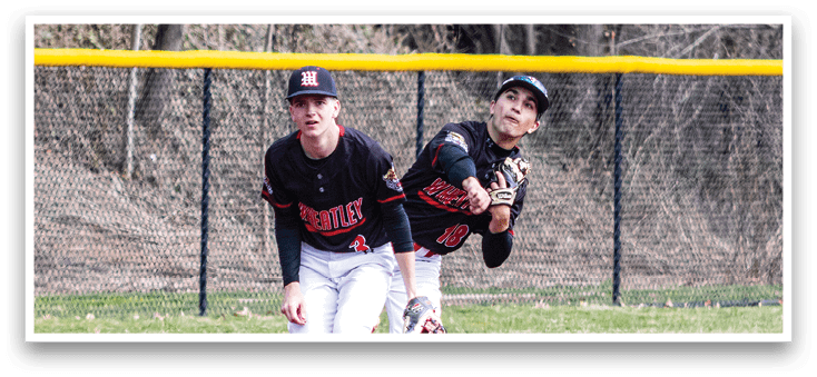 Baseball players on a field. Description generated by AI