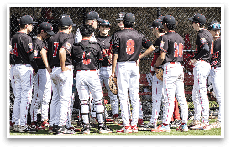 A group of baseball players wearing black and red uniforms. Description generated by AI