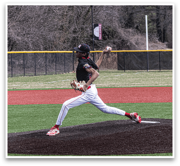 A baseball player in a black shirt and white pants is pitching a ball. Description generated by AI