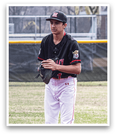 A baseball player wearing a black shirt and white pants. Description generated by AI