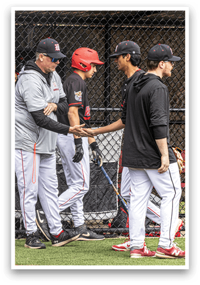A group of baseball players on a field. Description generated by AI