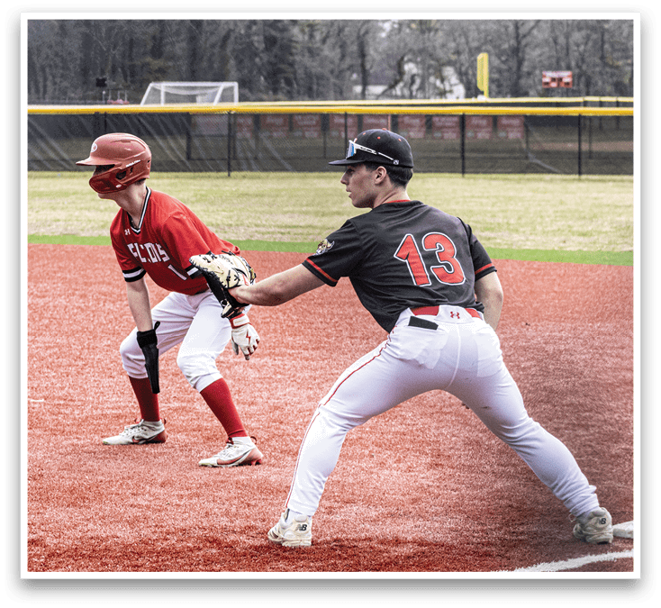 A baseball player in a black shirt and white pants is running to a base. Description generated by AI