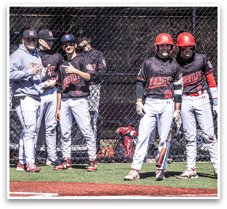 Baseball players standing on a field. Description generated by AI