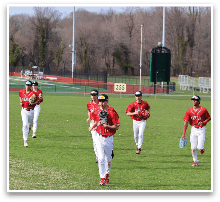 A group of baseball players on a field. Description generated by AI