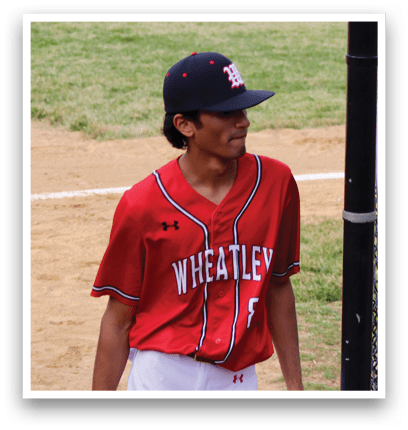A baseball player wearing a red and black jersey. Description generated by AI