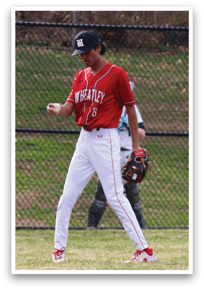 A man wearing a red and white baseball uniform. Description generated by AI