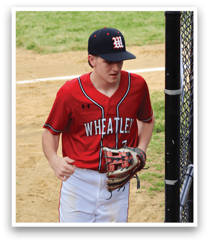A baseball player wearing a red shirt and white pants. Description generated by AI