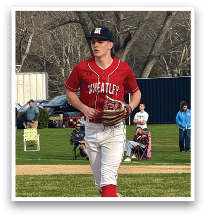A baseball player wearing a red and white uniform. Description generated by AI