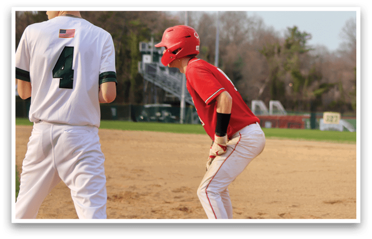 A baseball player wearing a red shirt and red helmet. Description generated by AI