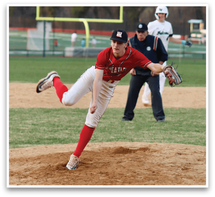 A baseball player in a red shirt and white pants is pitching a ball. Description generated by AI