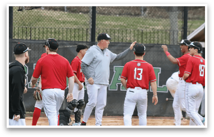 A group of baseball players on a field. Description generated by AI