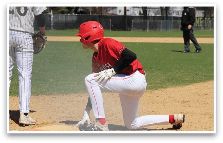 A baseball player wearing a red shirt and red helmet. Description generated by AI