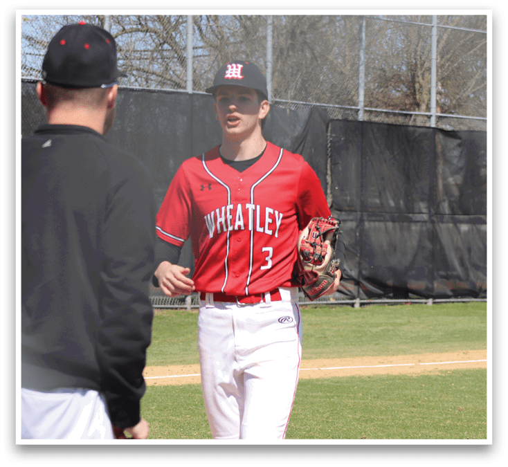 A baseball player is swinging a bat at a ball. Description generated by AI