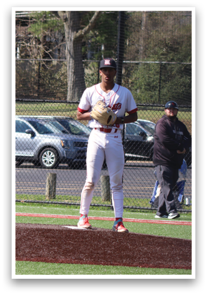 A baseball player standing on a field. Description generated by AI