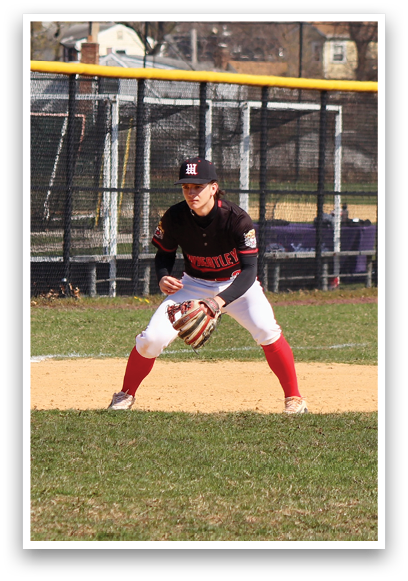 A baseball player wearing a black and red uniform. Description generated by AI