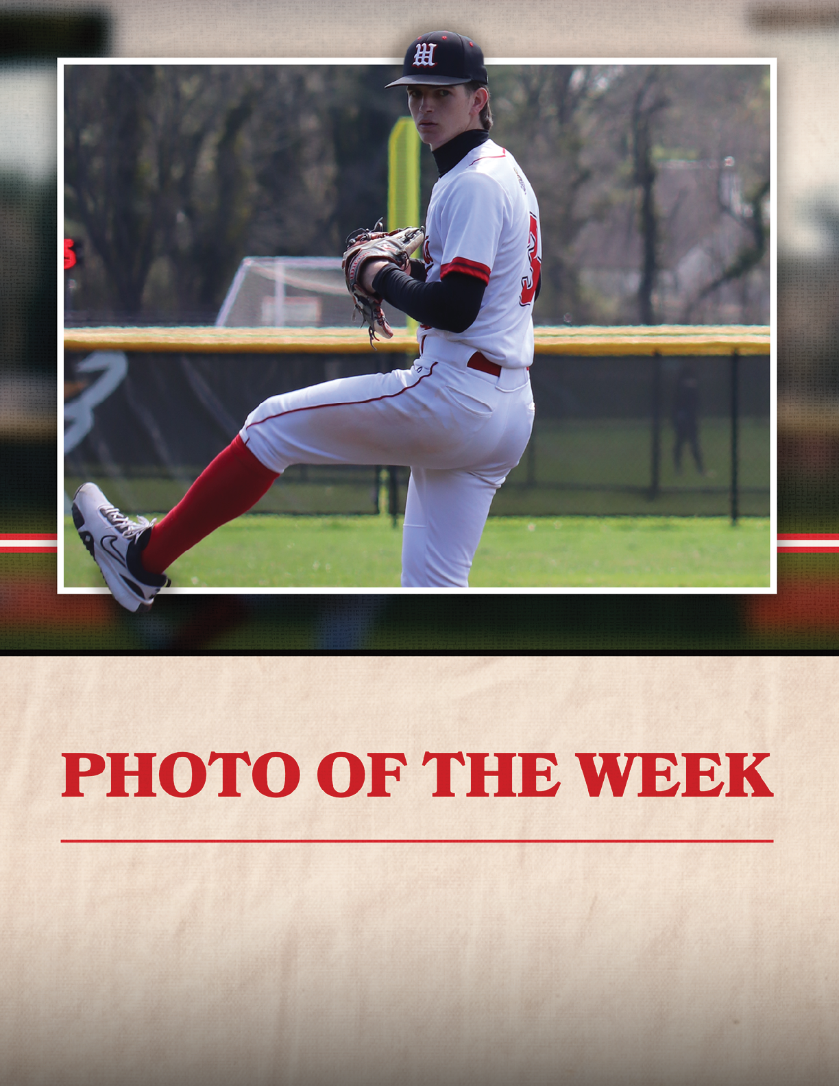 A baseball player in a white and red uniform. Description generated by AI