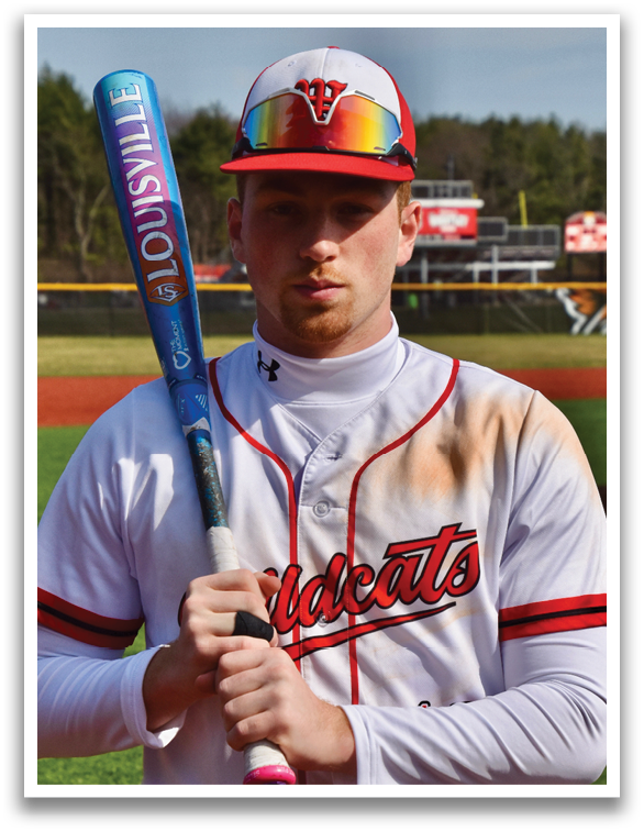 A baseball player holding a bat. Description generated by AI