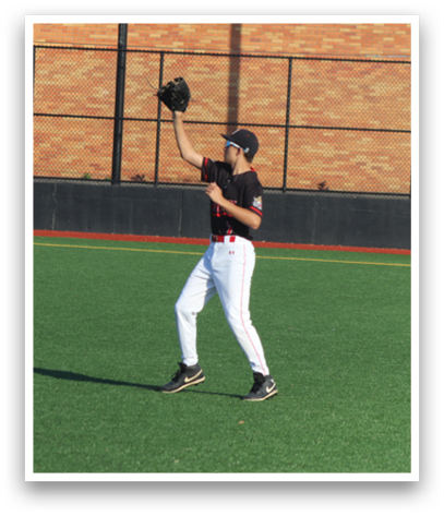 A baseball player wearing a black shirt and white pants is holding a baseball glove. Description generated by AI