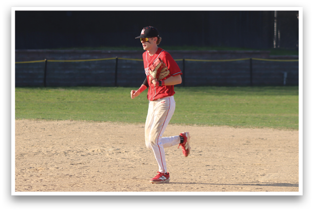 A baseball player running on the field. Description generated by AI