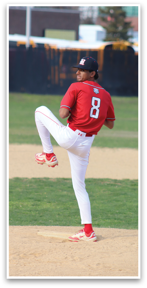 A baseball player wearing a red shirt and white pants is throwing a ball. Description generated by AI