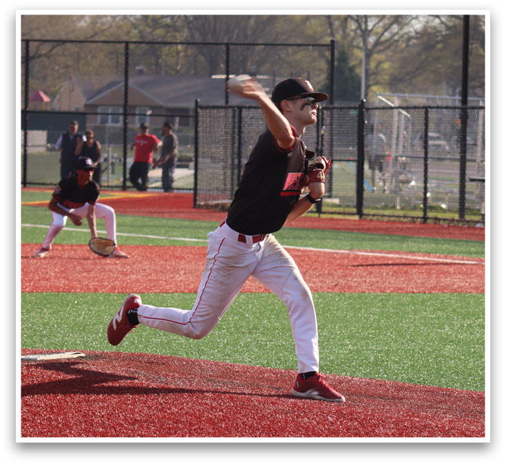 A baseball player in a black shirt and white pants is throwing a ball. Description generated by AI