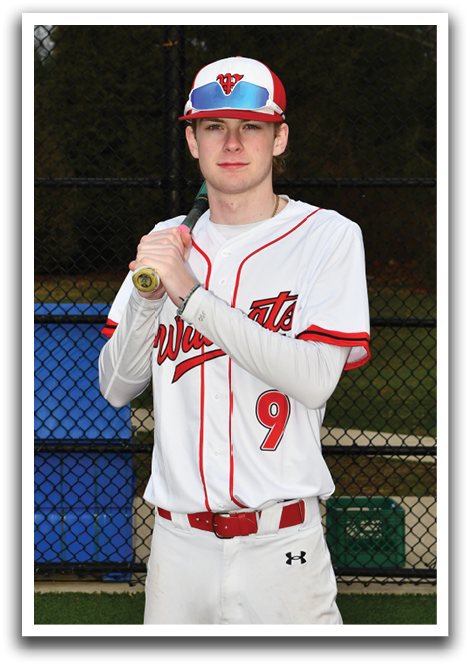 A baseball player holding a bat. Description generated by AI