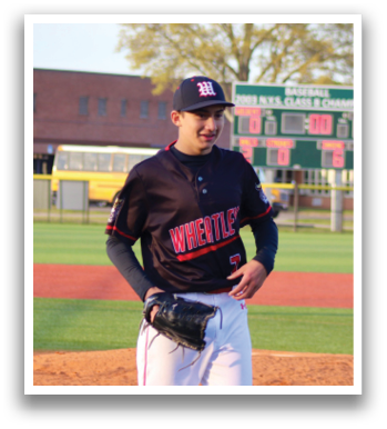 A baseball player wearing a black and red jersey. Description generated by AI